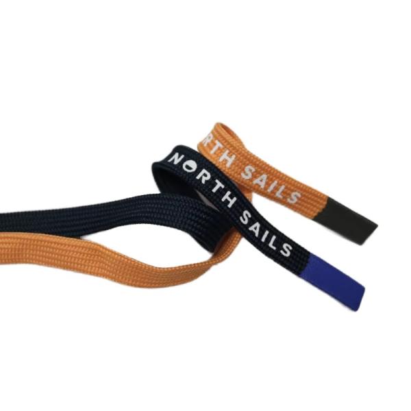 Cordon de serrage plat personnalisé en polyester avec embout en silicone pour pantalon et vêtement
