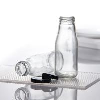 Sin BPA 25 oz 32 oz Jugo de pasterización Leche botella de vidrio de entrega con tapa de metal