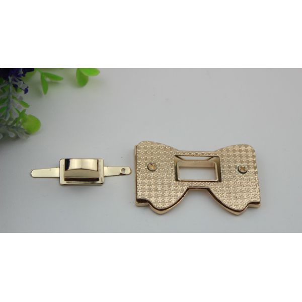 High polish gold metal bow-knot pattern zinc alloy fashion twist turn locks for purse