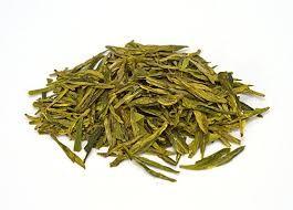 Bagged Fermented organic dragon well tea with very distinctive shape