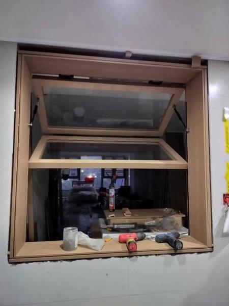 Flow Fireplace Proximity Folding Window Providing Controlled Ventilation During Wood Burning