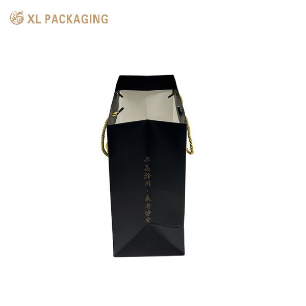 Custom Logo Matte Black Paper Tote Bag with Kraft Calligraphy Stickers and Twisted Golden Cord Handles for Eco-Friendly Gift Packaging
