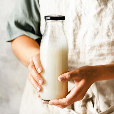 Embossed Logo 32Oz 1 Liter Heat Resistant Milk Delivery Glass Bottles With Cap