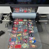 Impressora UV Roll de Dtf com a cabeça de impressão Tx800 e o laminador todos em um para a impressora plástica da máquina de impressão da caixa do telefone