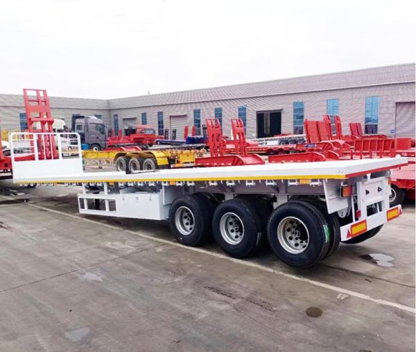 Truck Trailer Flatbed Semi Trailer With 30-60 Tons Loading Capacity And 1 Tool Box Big Chamber