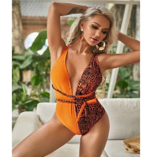 Das mulheres apertadas instantâneas da praia do triângulo do roupa de banho de uma peça só das senhoras do decote em V as senhoras uma do roupa de banho remendam o sunprotection do roupa de banho
