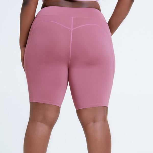 Quadril alto do short da ioga do Waisted das mulheres despidas que levanta mais a roupa do exercício do tamanho