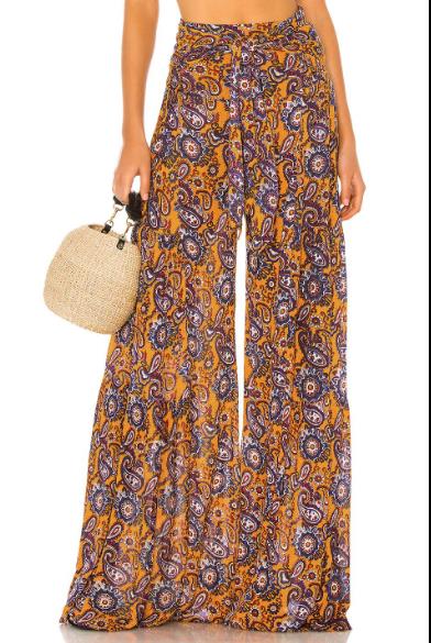 Le pantalon occasionnel lâche des femmes échoue au loin le pantalon lâche d'impression de jambe