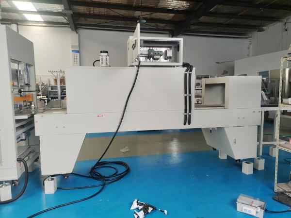 Straight-line heat-shrink packaging machine