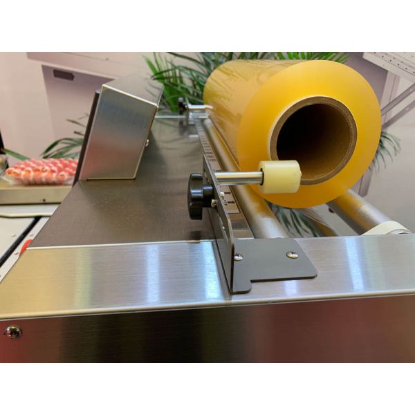 Electric Automatic PLC-Controlled Plastic Wrap Packaging Machine for Food and Commodity Sealing