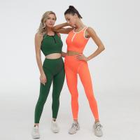 Le yoga de femmes de guêtres de forme physique de GYMNASE d'OEM place le demi fabricant de Legging de dessus de tirette