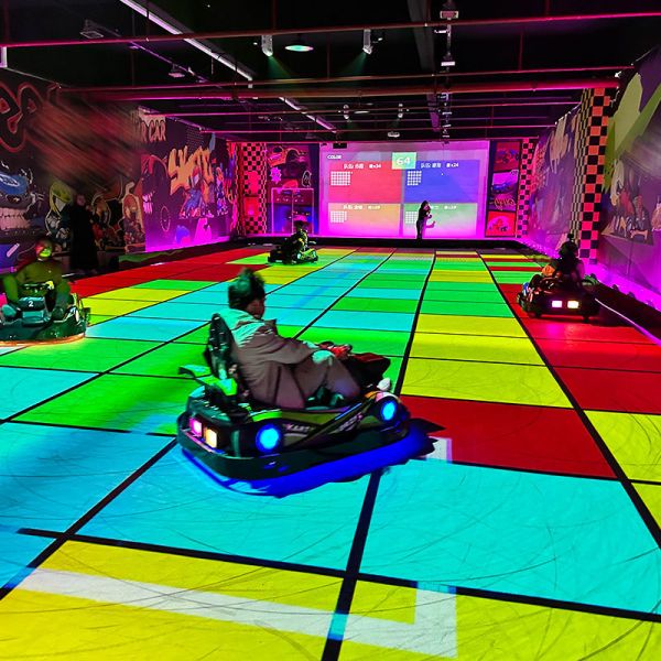 Dynamic Projection Karting: High-Precision AR Racing with Real-Time Interactive Effects