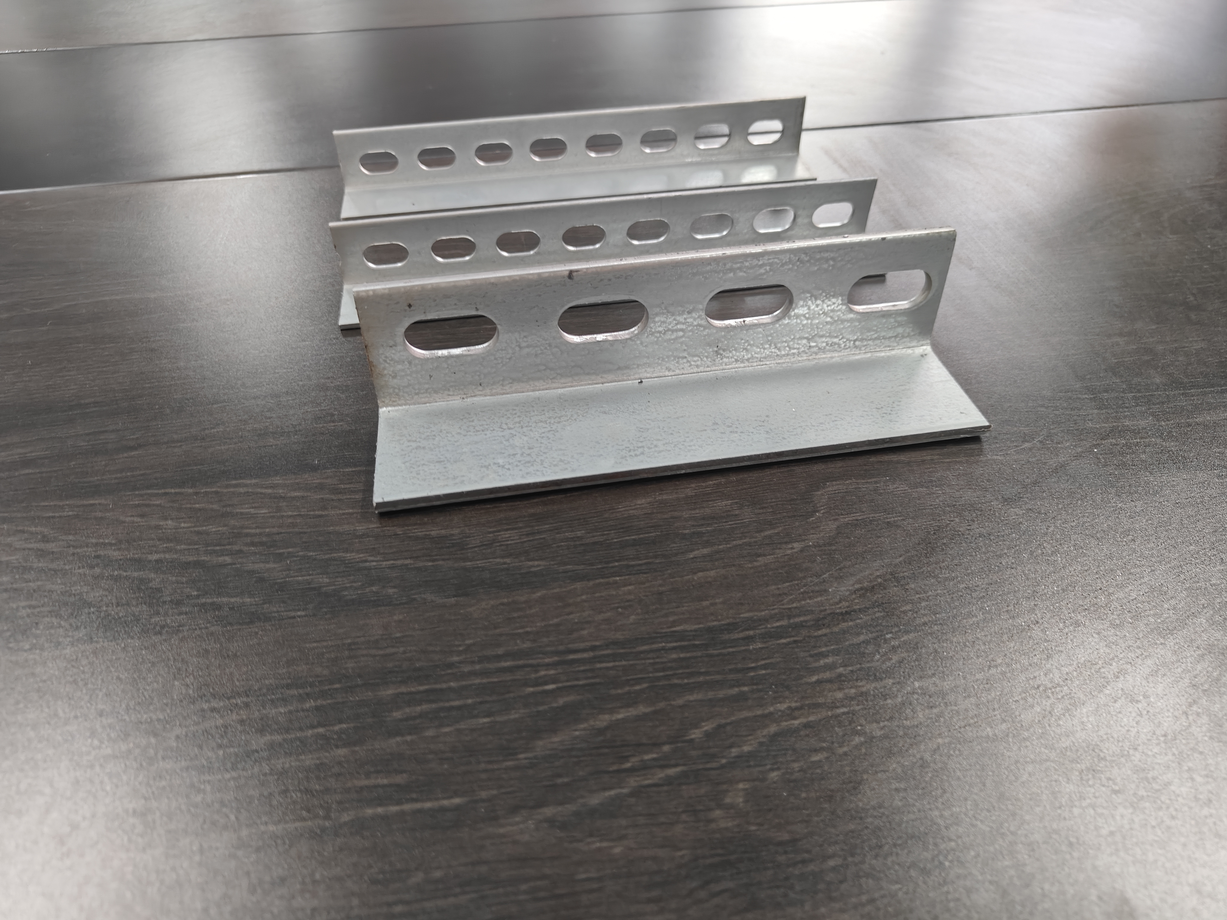 Perforated Punched Angle Iron Structural Steel Profiles with Galvanized Polished or Painted Finishes for Long Lasting Industrial