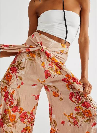 Le pantalon occasionnel lâche des femmes échoue au loin le pantalon lâche d'impression de jambe