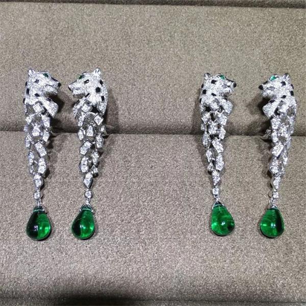 C Cheetah Earrings - showing the charm of courage, naughty or docile .310 round bright cut diamonds, emerald and onyx.