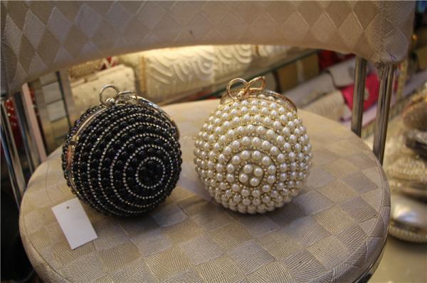 Round high-grade pearls evening bags woman holding a high-end fashion evening bag bride