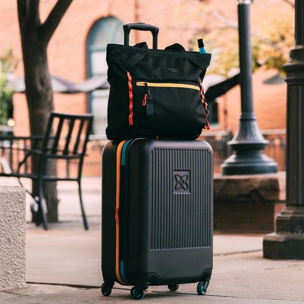 Durable suitcase with anti crush exterior mesh compression panel and compression strap designed for hassle free travel