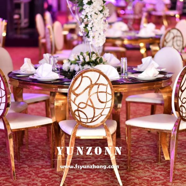 Louis Modern Round Marble Dining Table with Polished Gold Stainless Steel Serpentine Legs for Hotels or Living Rooms
