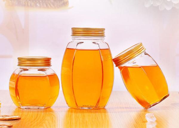 Tampa dourada de Honey Jars With Twist Off do vidro de vidro do hexágono da garrafa do doce