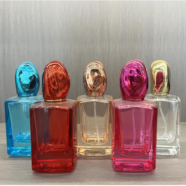 Botella de perfume azul de fondo cuadrado de alta gama con caja personalizada de vidrio transparente de 30 ml de 50 ml