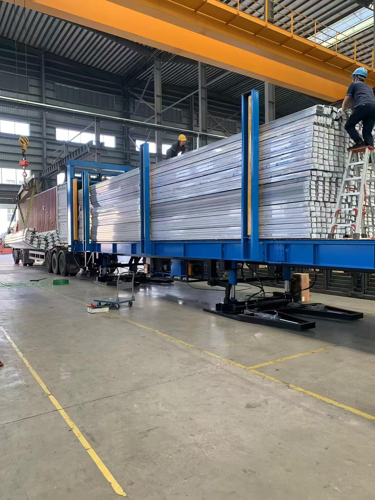 Robust container loading machine featuring hydraulic lifting system and automated controls for improved operational speed