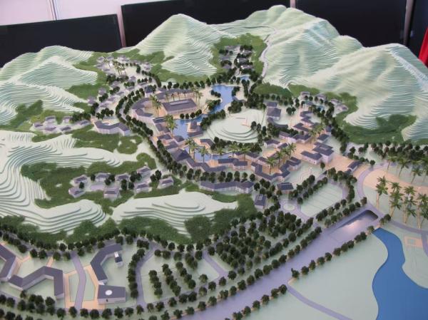 Architectural Model of Urban Master Plan with Green Landscape, Roads, and Mixed-Use Developments