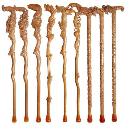 A mão de madeira do artesanato 90cm cinzelou bengalas
