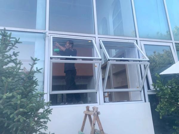 Pass Kitchen-to-Patio Folding Window Solution Facilitating Outdoor Dining Service During Summer Entertaining