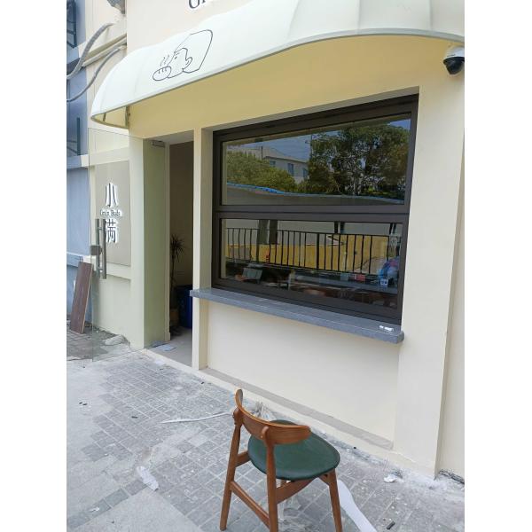 Wide-Format Folding Window Configuration Framing Mountain Vistas and Urban Skyline Views with Minimal Framework