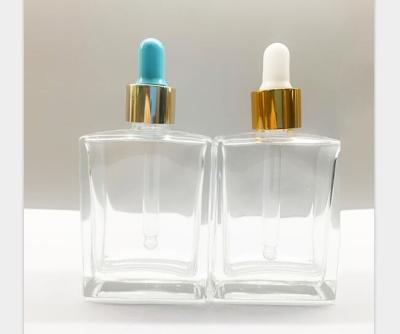 a garrafa de vidro retangular do conta-gotas das garrafas do óleo essencial de 30ml 50ml com ouro Shinny o OEM do colar
