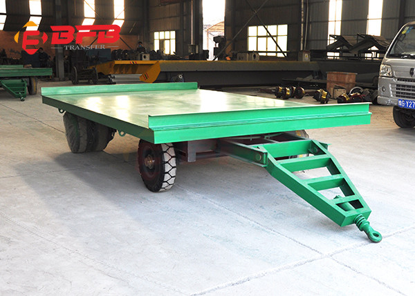 Forklift Towing Flatbed Steel Coil Trailers On Cement Floor