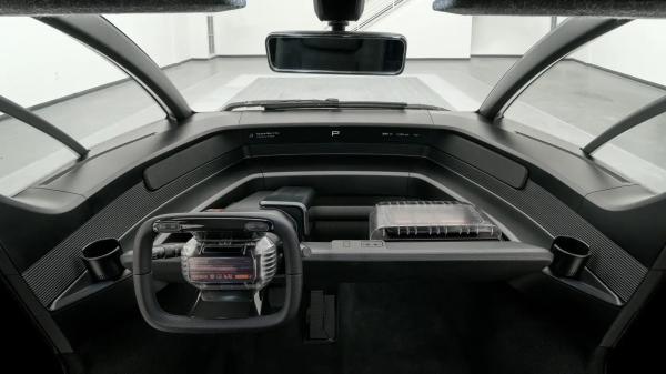 A purpose-built trcuk Canoo pickup w 8 ft bed with ample storage interior