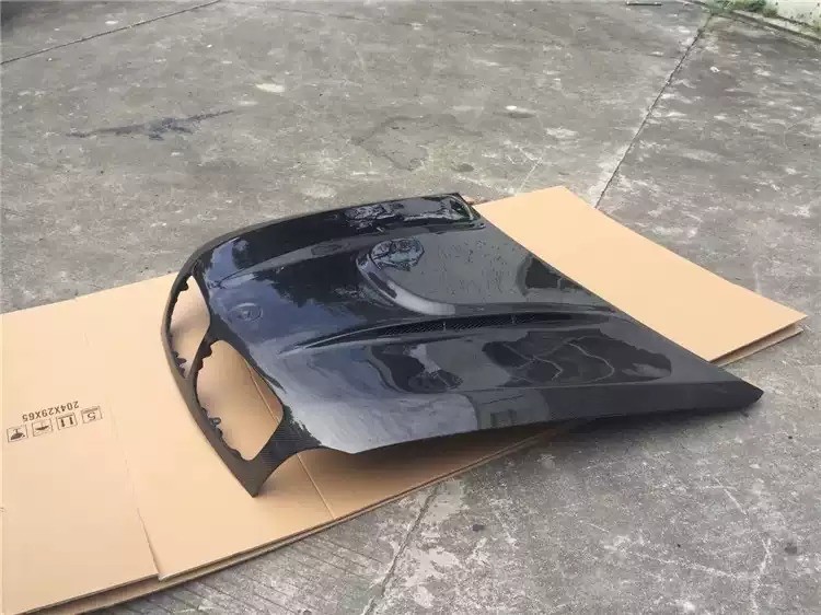 Transform Your BMW X6M E71 with HAMANN Carbon Fiber Front Cover and Spot Design