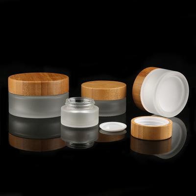 O creme cosmético de vidro geado da garrafa de garrafas de vidro da tampa de bambu range o GV