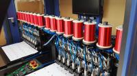 時速3000～3500枚のカードユニットを生産可能な、MOXAモーションコントロール搭載の非接触型カードインレイ生産ライン