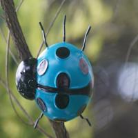 Le petit jardin de Ladybird en métal ornemente le décor artistique de mur de coccinelle en métal