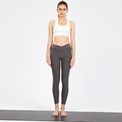 A ioga veste o Spandex 50% que de 50% as senhoras misturadas de nylon malham calças e partes superiores aptas