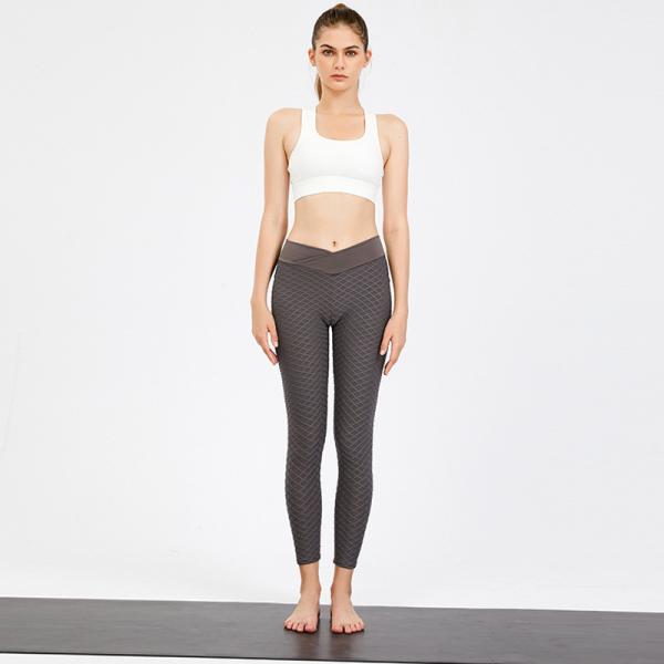 A ioga veste o Spandex 50% que de 50% as senhoras misturadas de nylon malham calças e partes superiores aptas