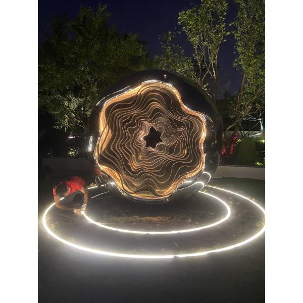Outdoor garden at night large abstract sculpture LED lights with light wave changes welcome custom sculpture