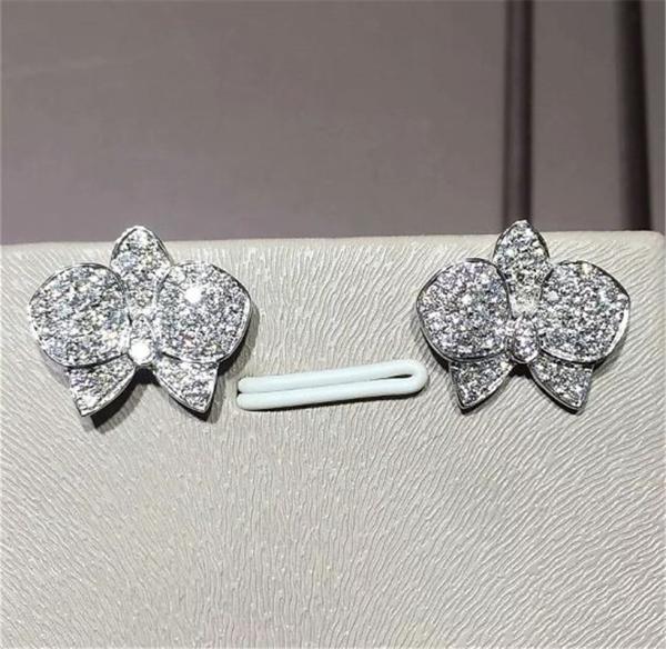 C orchid Earrings 18K white gold, each with 27 diamonds.Carving delicate petals with precious materials