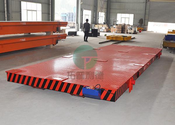 Battery powered self propelled motorized transfer trailer with intelligent charger