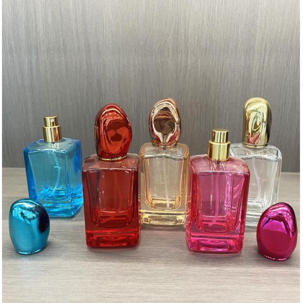 Botella de perfume azul de fondo cuadrado de alta gama con caja personalizada de vidrio transparente de 30 ml de 50 ml