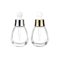 Garrafas funcionais de gotas de cosméticos Garrafa de vidro espessa de 30 ml com gotas de ouro