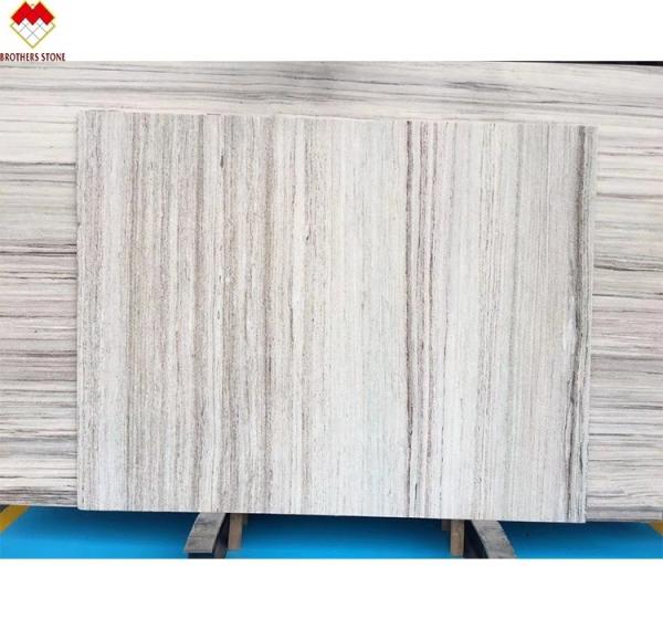 White Wood Look Marble Tiles Stair Follow Veins for a Versatile and Timeless Design