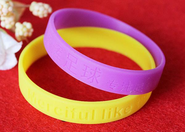 Lettering Debossed Silicone Wristbands , Rubber Promotional Bracelets Smooth Edge
