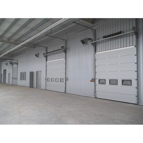 Высокоскоростные промышленные секционные дверцы с наружными роликами