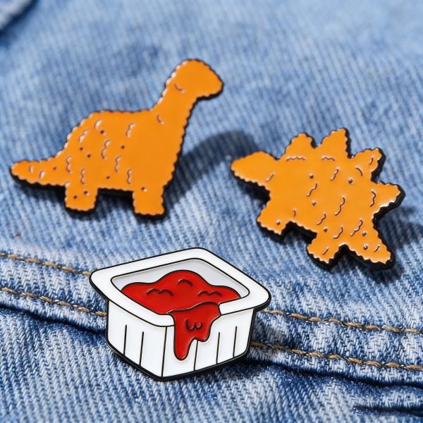Custom enamel pins with glitter, soft/hard finish, and cute cartoon anime design.