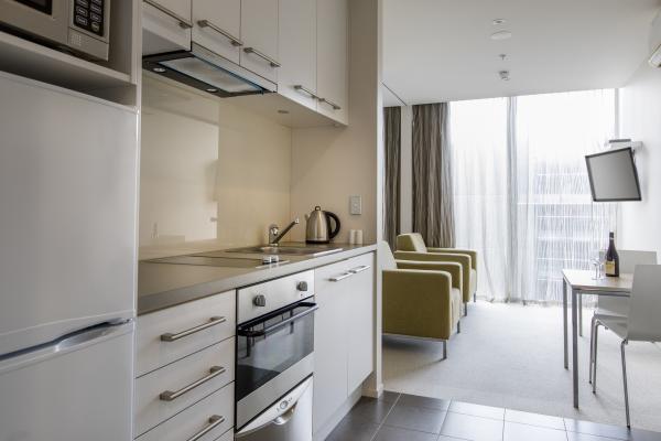 Fashion hotel style apartment usd laminate kitchen cabinets with Upholstered bed and Sofa chairs