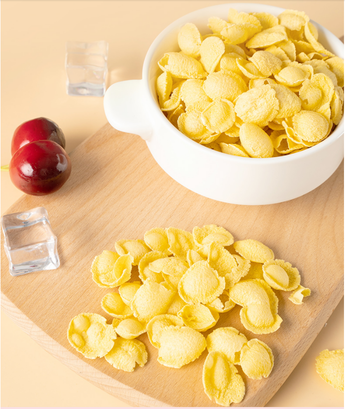 Мозоль хлопьй для завтрака шелушится изготовляя еда упакованная корнфлексами здоровая