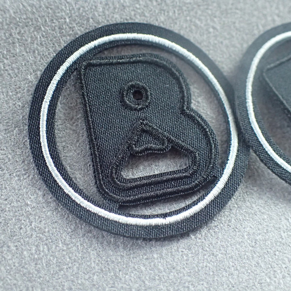 Черные спорт OEKO вышили ярлыкам одежды